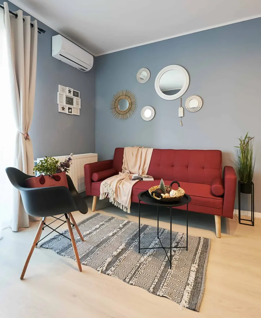 Quadra Trees - living room with red sofa